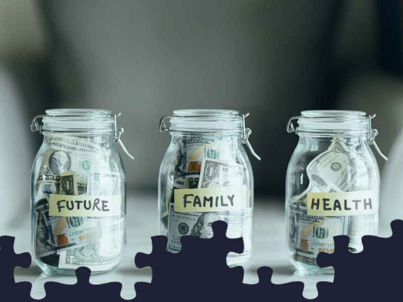 Three glass jars of savings labeled future, family, and health